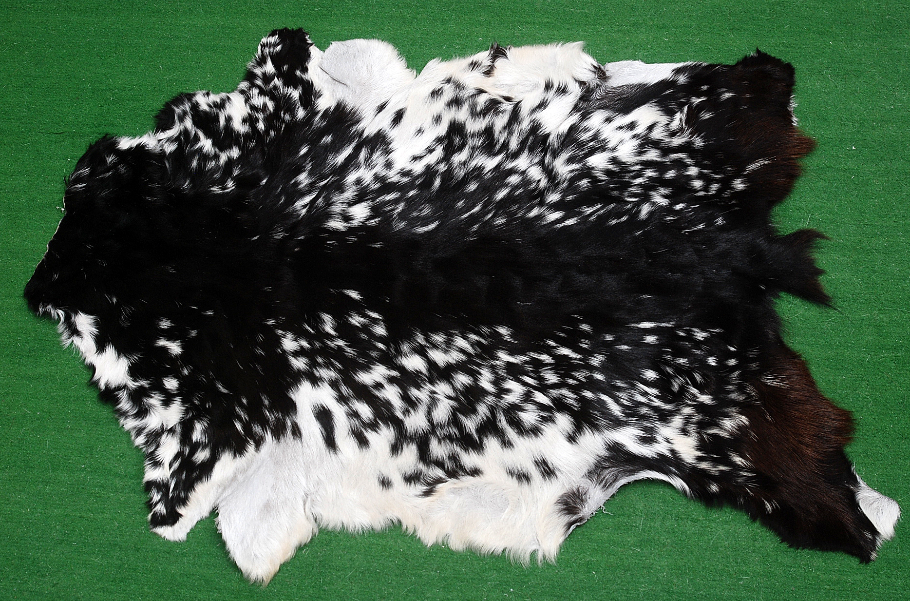 Handcrafted goathide rug with soft texture and natural finish